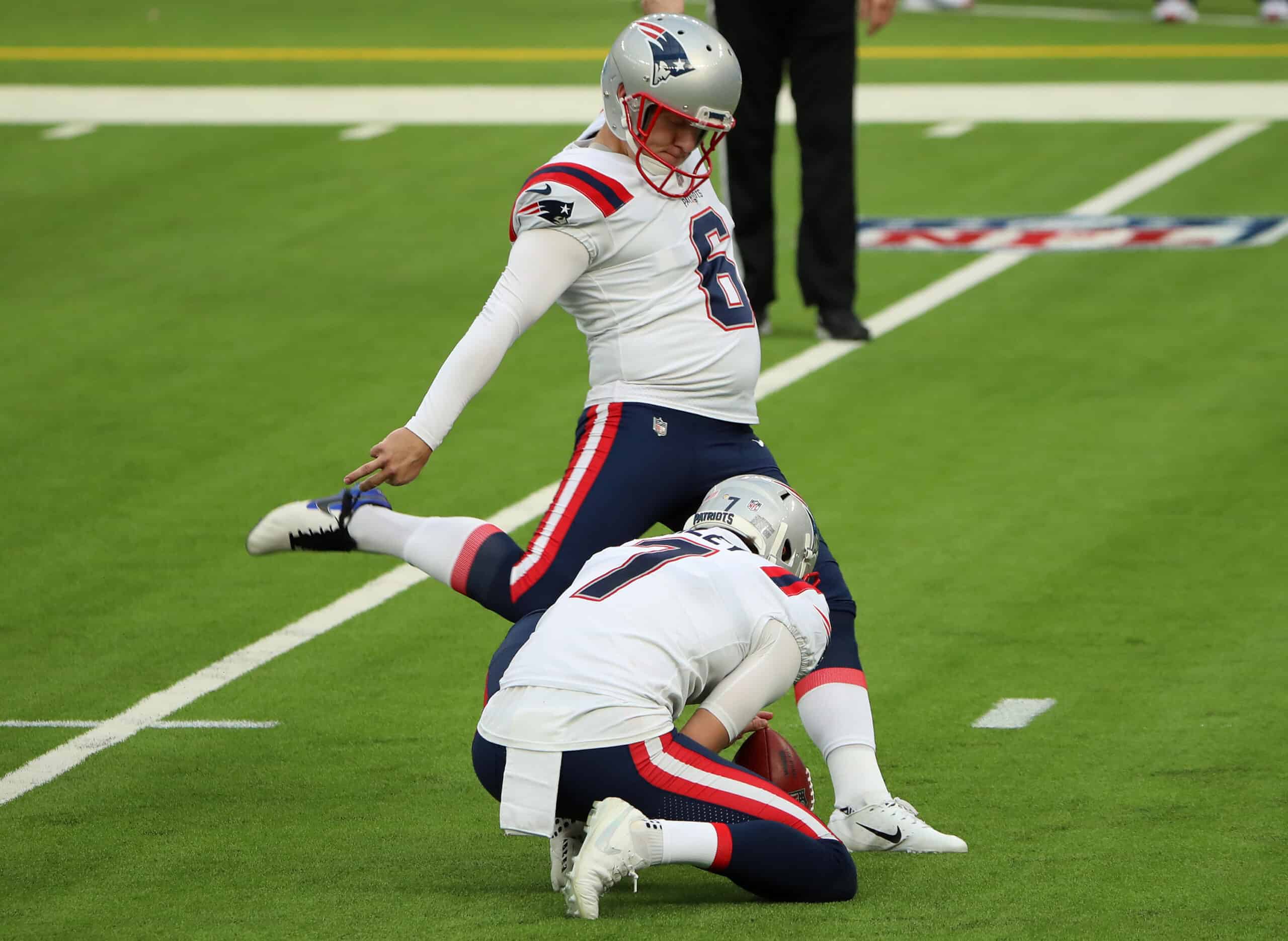 Place kicker Nick Folk #6 of the New England Patriots kicks the extra point for the 14-0 lead in the second quarter against the Los Angeles Chargers at SoFi Stadium on December 06, 2020 in Inglewood, California.