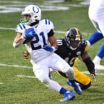Running back Nyheim Hines #21 of the Indianapolis Colts runs with the ball as linebacker Tegray Scales #40 of the Pittsburgh Steelers tries for the tackle in the second quarter of their game at Heinz Field on December 27, 2020 in Pittsburgh, Pennsylvania.