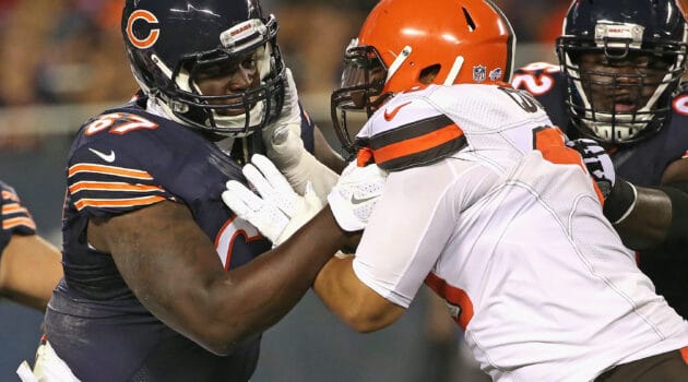 Jordan Mills #67 of the Chicago Bears blocks Xavier Cooper #96 of the Cleveland Browns during a preseason game at Soldier Field on September 3, 2015 in Chicago, Illinois. The Bears defeated the Browns 24-0.