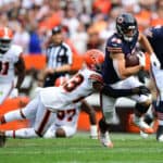 Troy Hill #23 of the Cleveland Browns tackles Cole Kmet #85 of the Chicago Bears in the game at FirstEnergy Stadium on September 26, 2021 in Cleveland, Ohio.