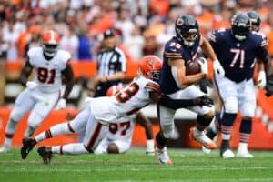 Troy Hill #23 of the Cleveland Browns tackles Cole Kmet #85 of the Chicago Bears in the game at FirstEnergy Stadium on September 26, 2021 in Cleveland, Ohio.