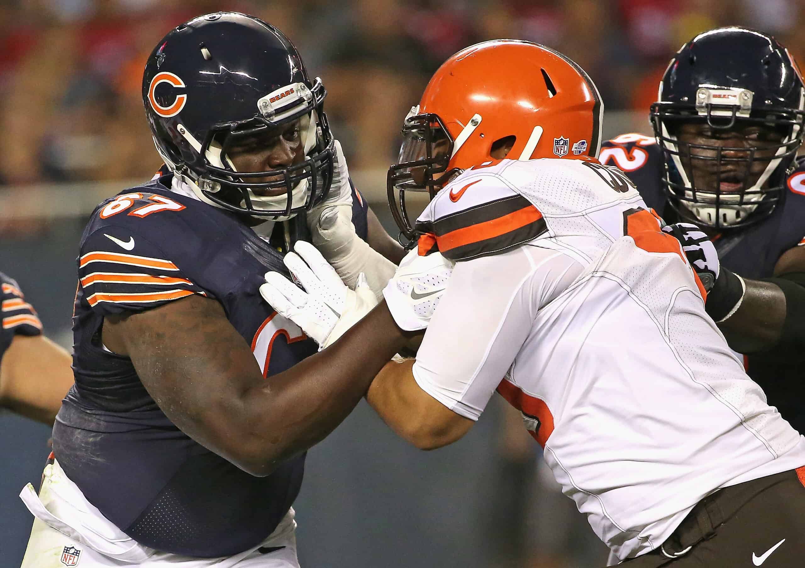 Jordan Mills #67 of the Chicago Bears blocks Xavier Cooper #96 of the Cleveland Browns during a preseason game at Soldier Field on September 3, 2015 in Chicago, Illinois. The Bears defeated the Browns 24-0.