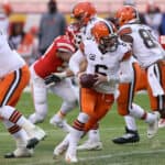 Quarterback Baker Mayfield #6 of the Cleveland Browns drops back to pass against the defense of the Kansas City Chiefs during the AFC Divisional Playoff game at Arrowhead Stadium on January 17, 2021 in Kansas City, Missouri.