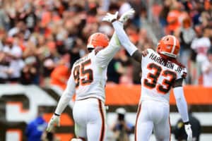 Myles Garrett #95 and Ronnie Harrison #33 of the Cleveland Browns celebrate during the fourth quarter in the game against the Chicago Bears at FirstEnergy Stadium on September 26, 2021 in Cleveland, Ohio.