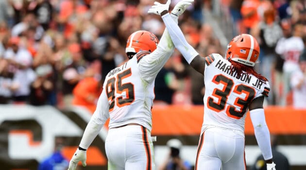 Myles Garrett #95 and Ronnie Harrison #33 of the Cleveland Browns celebrate during the fourth quarter in the game against the Chicago Bears at FirstEnergy Stadium on September 26, 2021 in Cleveland, Ohio.