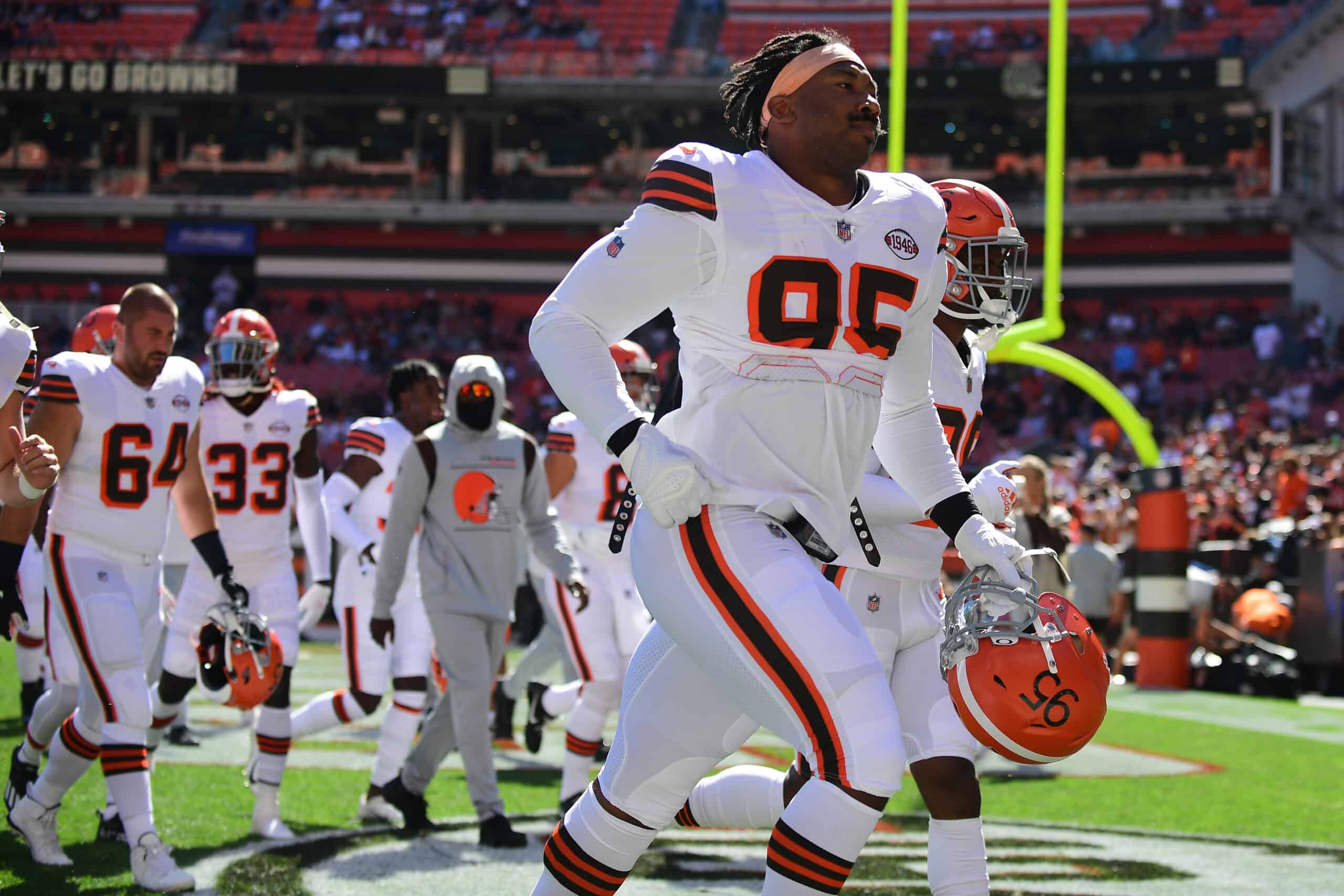 Myles Garrett #95 of the Cleveland Browns and the team head off the field after warm-ups before the game against the Chicago Bears at FirstEnergy Stadium on September 26, 2021 in Cleveland, Ohio.