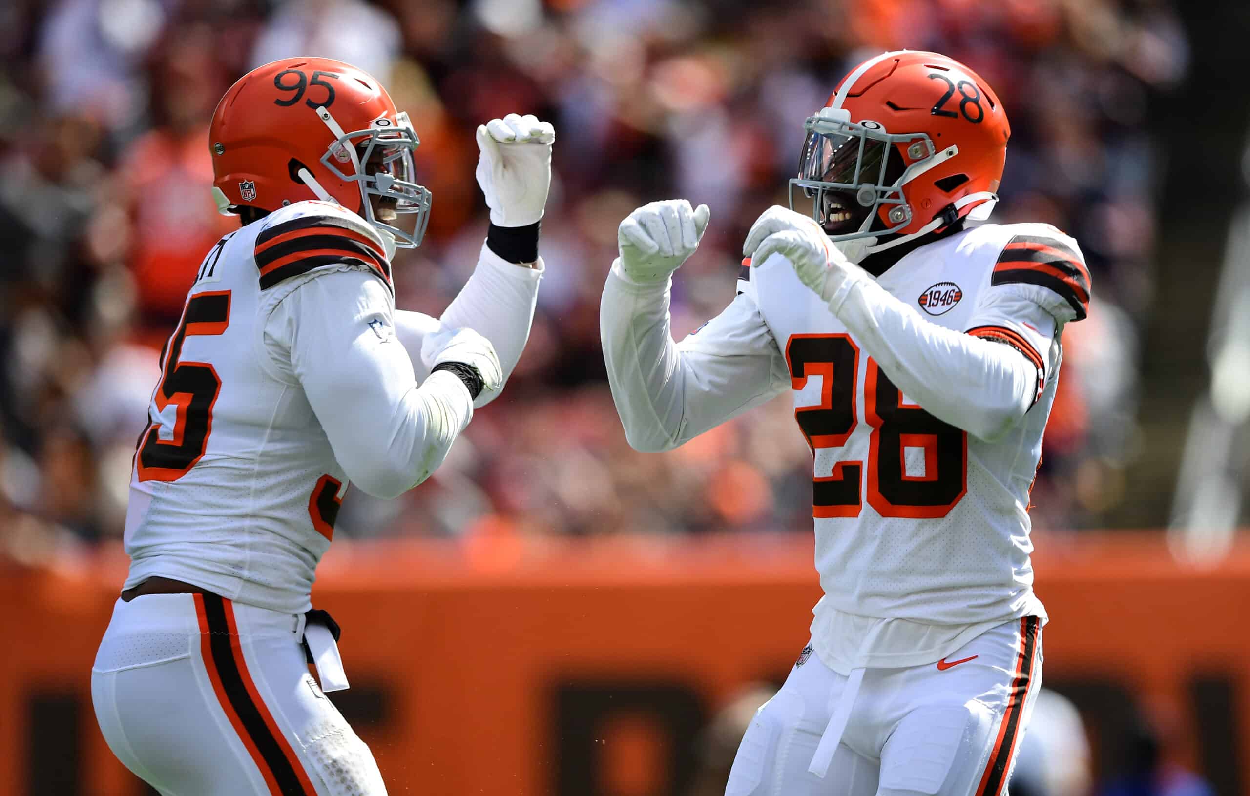 Myles Garrett #95 and Jeremiah Owusu-Koramoah #28 of the Cleveland Browns celebrate after stopping Justin Fields #1 of the Chicago Bears (not picture) during the first half in the game at FirstEnergy Stadium on September 26, 2021 in Cleveland, Ohio.