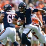 Justin Fields #1 of the Chicago Bears tries to avoid a sack by Myles Garrett #95 of the Cleveland Browns during the first half at FirstEnergy Stadium on September 26, 2021 in Cleveland, Ohio.