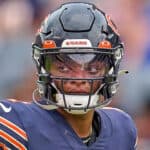 Chicago Bears quarterback Justin Fields (1) looks on during a preseason game between the Chicago Bears and the Buffalo Bills on August 21, 2021 at Soldier Field in Chicago, IL.