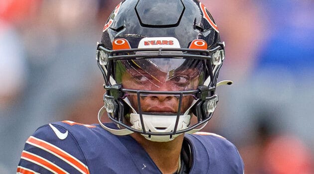 Chicago Bears quarterback Justin Fields (1) looks on during a preseason game between the Chicago Bears and the Buffalo Bills on August 21, 2021 at Soldier Field in Chicago, IL.