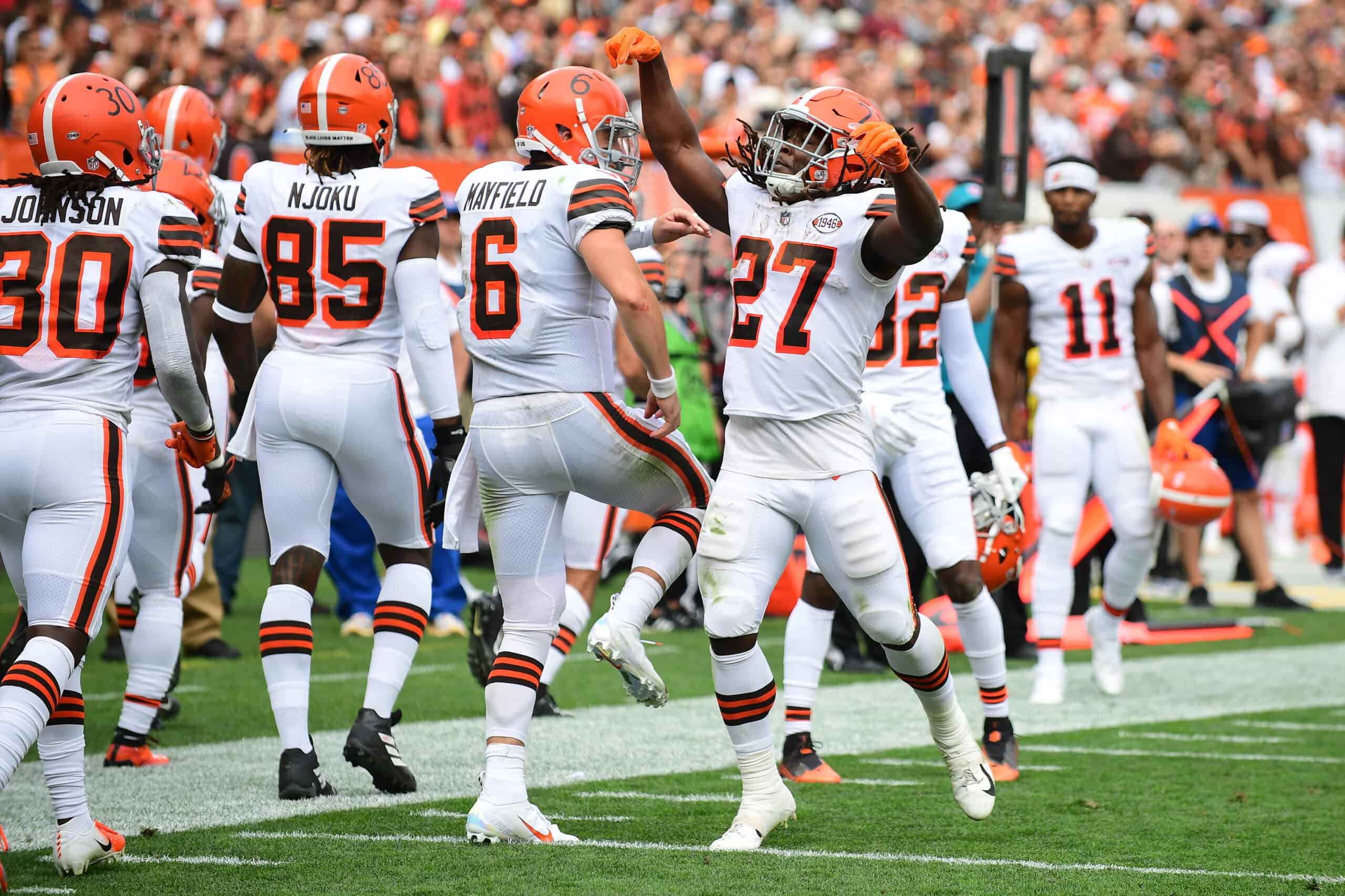 Kareem Hunt #27 of the Cleveland Browns celebrates with Baker Mayfield #6 after running the ball for a touchdown during the fourth quarter in the game against the Chicago Bears at FirstEnergy Stadium on September 26, 2021 in Cleveland, Ohio.