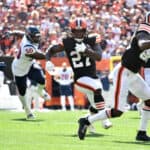 Running back Kareem Hunt #27 of the Cleveland Browns runs the ball during the first half in the game against the Houston Texans at FirstEnergy Stadium on September 19, 2021 in Cleveland, Ohio.