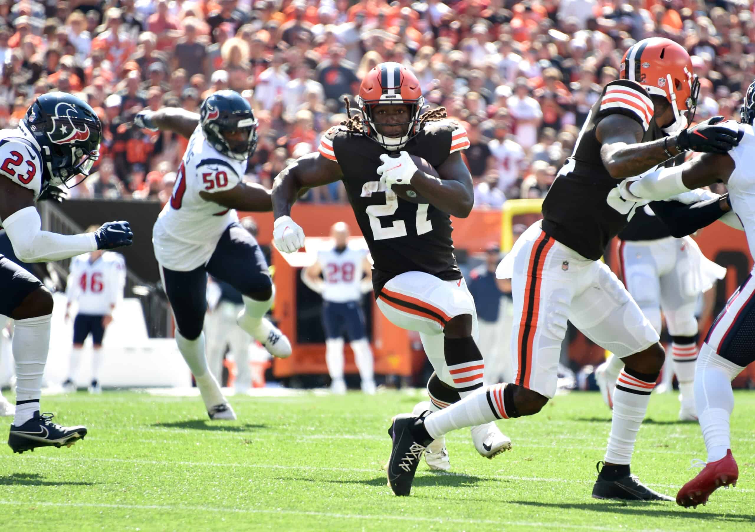 Running back Kareem Hunt #27 of the Cleveland Browns runs the ball during the first half in the game against the Houston Texans at FirstEnergy Stadium on September 19, 2021 in Cleveland, Ohio.