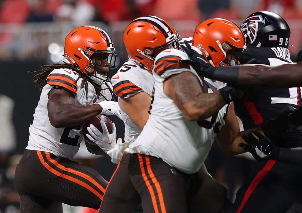 Kareem Hunt #27 of the Cleveland Browns rushes against the Atlanta Falcons during the first half at Mercedes-Benz Stadium on August 29, 2021 in Atlanta, Georgia.