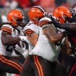 Kareem Hunt #27 of the Cleveland Browns rushes against the Atlanta Falcons during the first half at Mercedes-Benz Stadium on August 29, 2021 in Atlanta, Georgia.