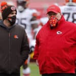 Head coach Kevin Stefanski of the Cleveland Browns and head coach Andy Reid of the Kansas City Chiefs talk on the field prior to the AFC Divisional Playoff game at Arrowhead Stadium on January 17, 2021 in Kansas City, Missouri.