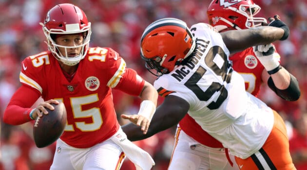 Quarterback Patrick Mahomes #15 of the Kansas City Chiefs scrables as defensive tackle Malik McDowell #58 of the Cleveland Browns defends during the game at Arrowhead Stadium on September 12, 2021 in Kansas City, Missouri.