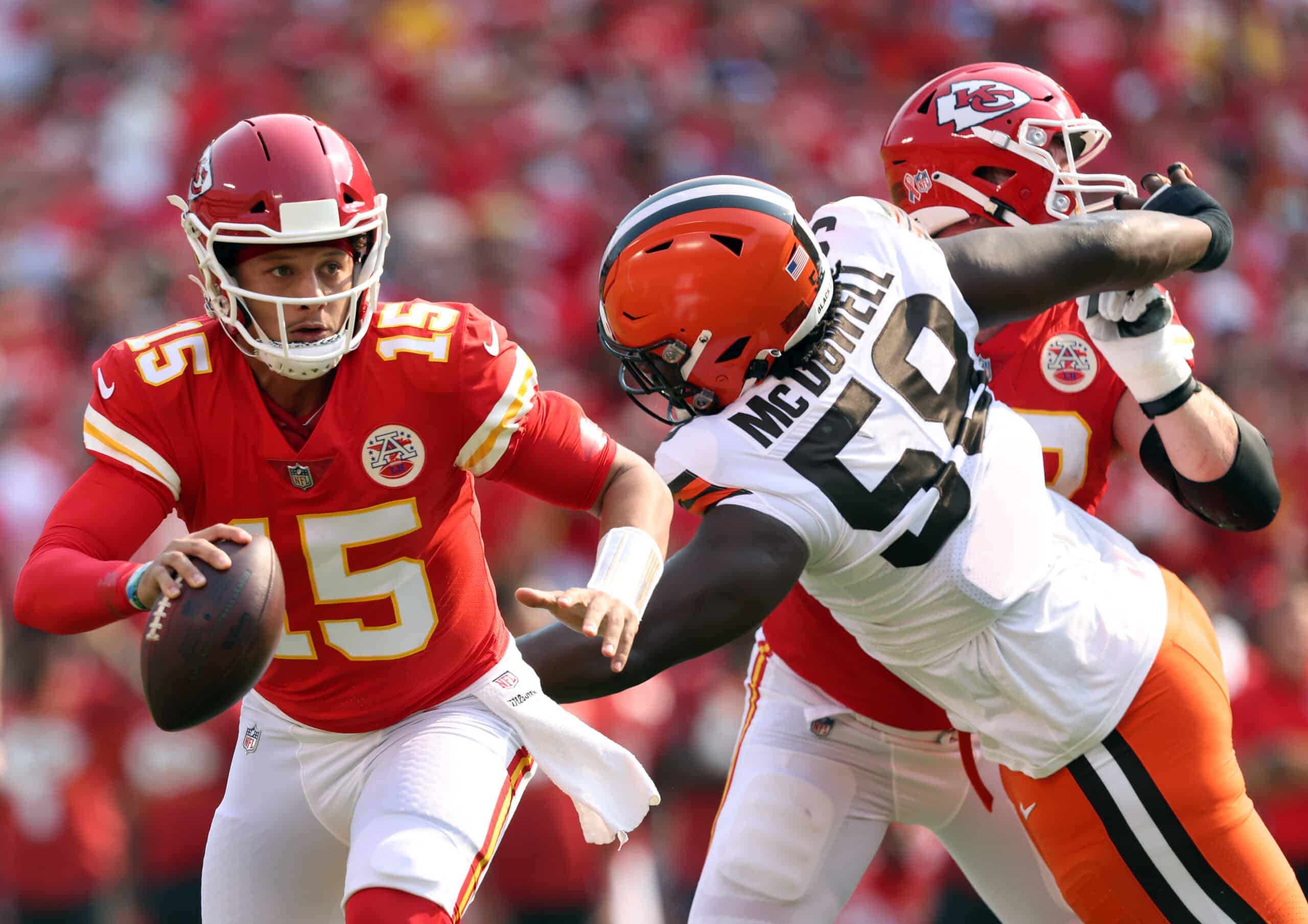 Quarterback Patrick Mahomes #15 of the Kansas City Chiefs scrables as defensive tackle Malik McDowell #58 of the Cleveland Browns defends during the game at Arrowhead Stadium on September 12, 2021 in Kansas City, Missouri.