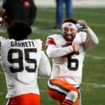 Baker Mayfield #6 and Myles Garrett #95 of the Cleveland Browns celebrate a victory over the Pittsburgh Steelers in the AFC Wild Card Playoff game at Heinz Field on January 10, 2021 in Pittsburgh, Pennsylvania.