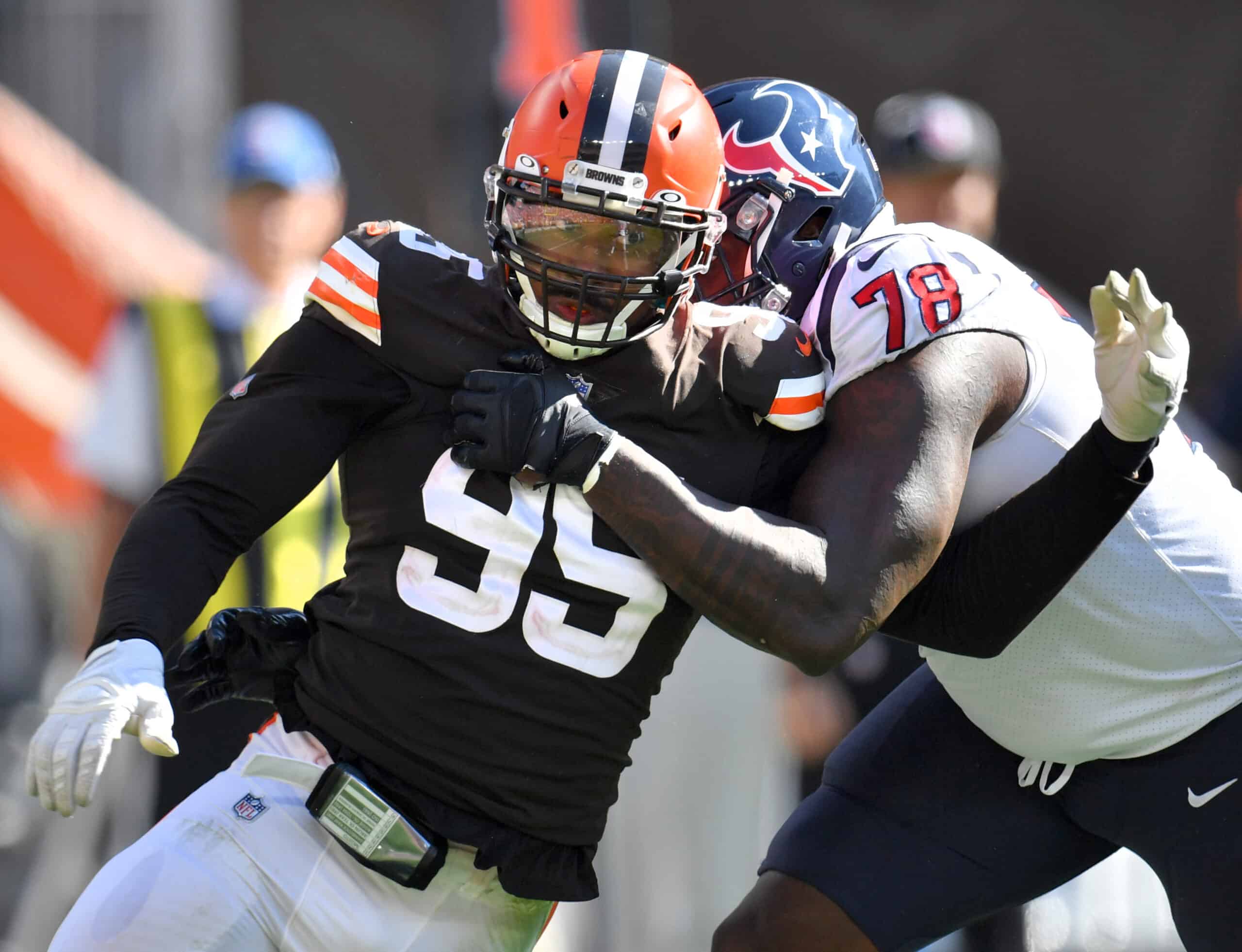 Defensive end Myles Garrett #95 of the Cleveland Browns battles with offensive tackle Laremy Tunsil #78 of the Houston Texans during the second half at FirstEnergy Stadium on September 19, 2021 in Cleveland, Ohio.