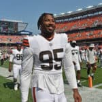 Defensive end Myles Garrett #95 of the Cleveland Browns walks off the field after the Browns defeated the New York Giants at FirstEnergy Stadium on August 22, 2021 in Cleveland, Ohio. The Browns defeated the Giants 17-13.