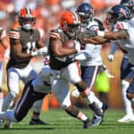 Running back Nick Chubb #24 of the Cleveland Browns tries to avoid a tackle by inside linebacker Zach Cunningham #41 of the Houston Texans during the second half at FirstEnergy Stadium on September 19, 2021 in Cleveland, Ohio.