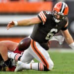 Baker Mayfield #6 of the Cleveland Browns fumbles the ball after a tackle from J.J. Watt #99 of the Arizona Cardinals during the third quarter at FirstEnergy Stadium on October 17, 2021 in Cleveland, Ohio.