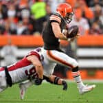 J.J. Watt #99 of the Arizona Cardinals tackles Baker Mayfield #6 of the Cleveland Browns during the third quarter at FirstEnergy Stadium on October 17, 2021 in Cleveland, Ohio.