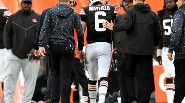 Baker Mayfield #6 of the Cleveland Browns is helped off the field by medical personnel after an injury during the third quarter against the Arizona Cardinals at FirstEnergy Stadium on October 17, 2021 in Cleveland, Ohio.