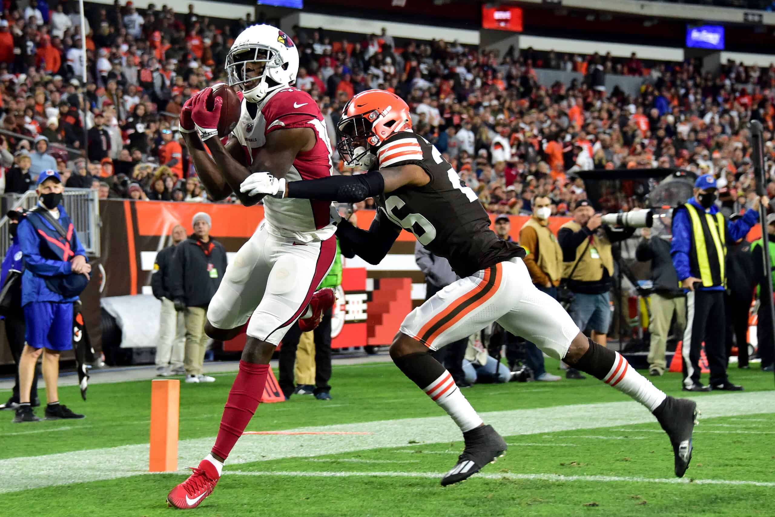 A.J. Green #18 of the Arizona Cardinals catches a touchdown pass under pressure by Greedy Williams #26 of the Cleveland Browns during the fourth quarter at FirstEnergy Stadium on October 17, 2021 in Cleveland, Ohio.