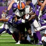 Myles Garrett #95 of the Cleveland Browns runs with the ball in the game against the Minnesota Vikings during the first quarter at U.S. Bank Stadium on October 03, 2021 in Minneapolis, Minnesota.