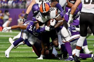 Myles Garrett #95 of the Cleveland Browns runs with the ball in the game against the Minnesota Vikings during the first quarter at U.S. Bank Stadium on October 03, 2021 in Minneapolis, Minnesota.