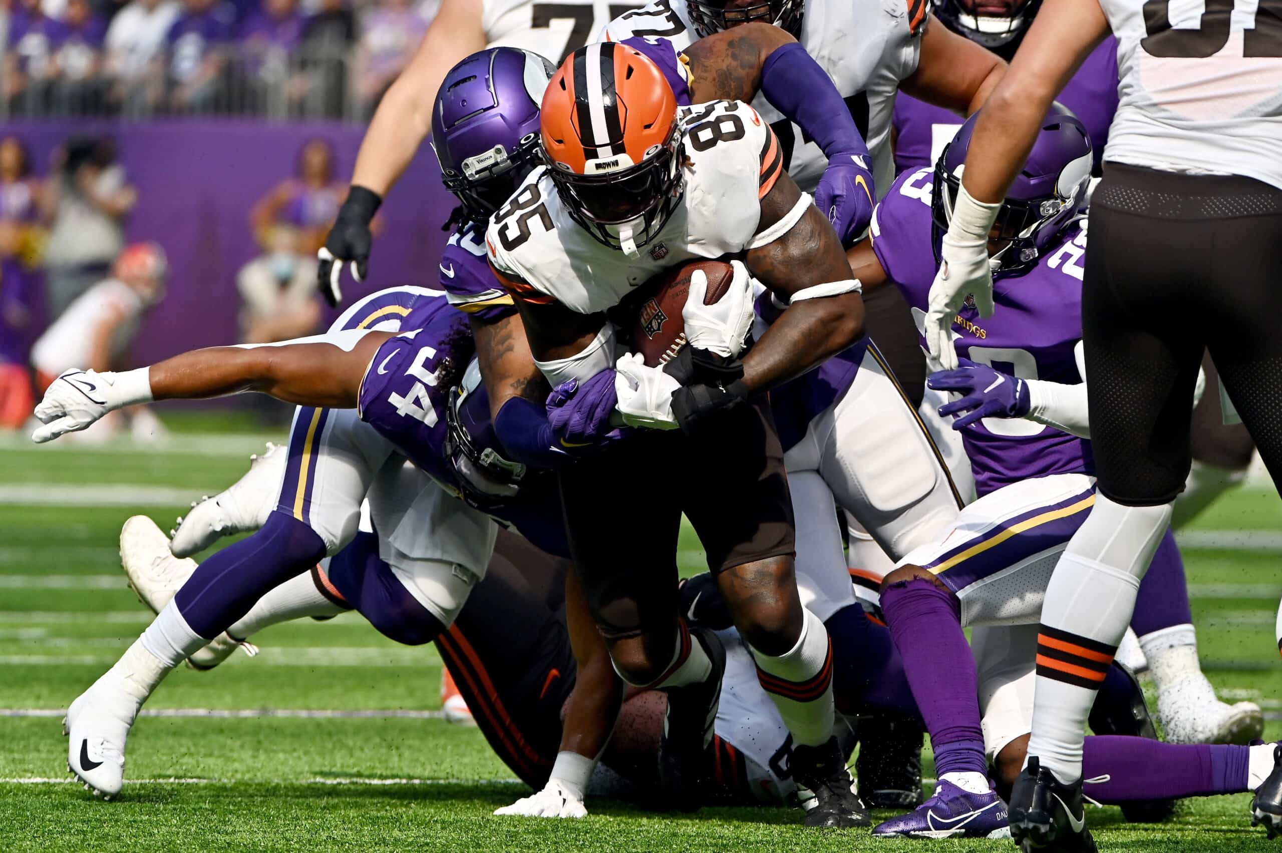 Myles Garrett #95 of the Cleveland Browns runs with the ball in the game against the Minnesota Vikings during the first quarter at U.S. Bank Stadium on October 03, 2021 in Minneapolis, Minnesota.