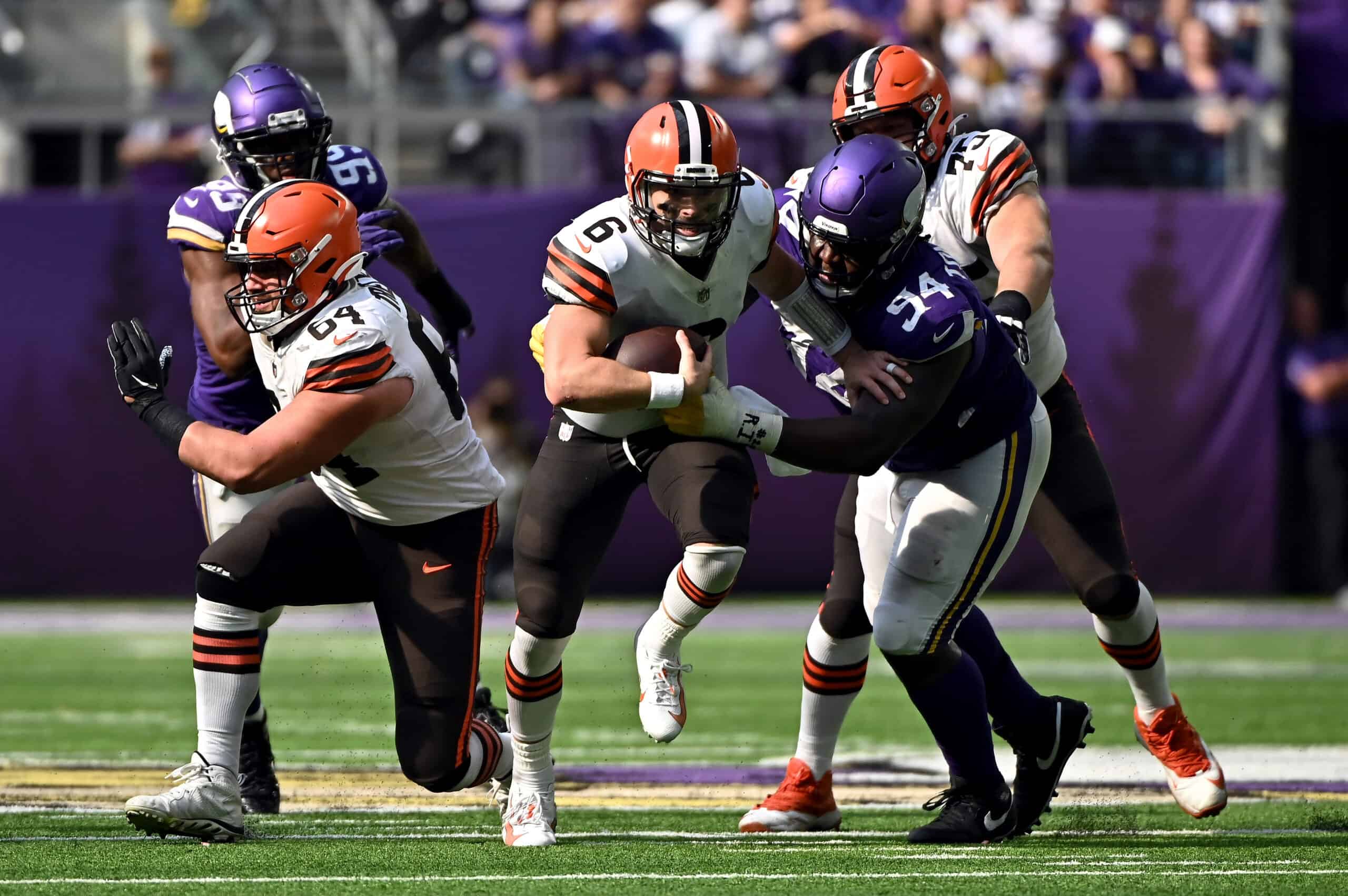 Baker Mayfield #6 of the Cleveland Browns is tackled while running the ball by Dalvin Tomlinson #94 of the Minnesota Vikings during the fourth quarter at U.S. Bank Stadium on October 03, 2021 in Minneapolis, Minnesota.