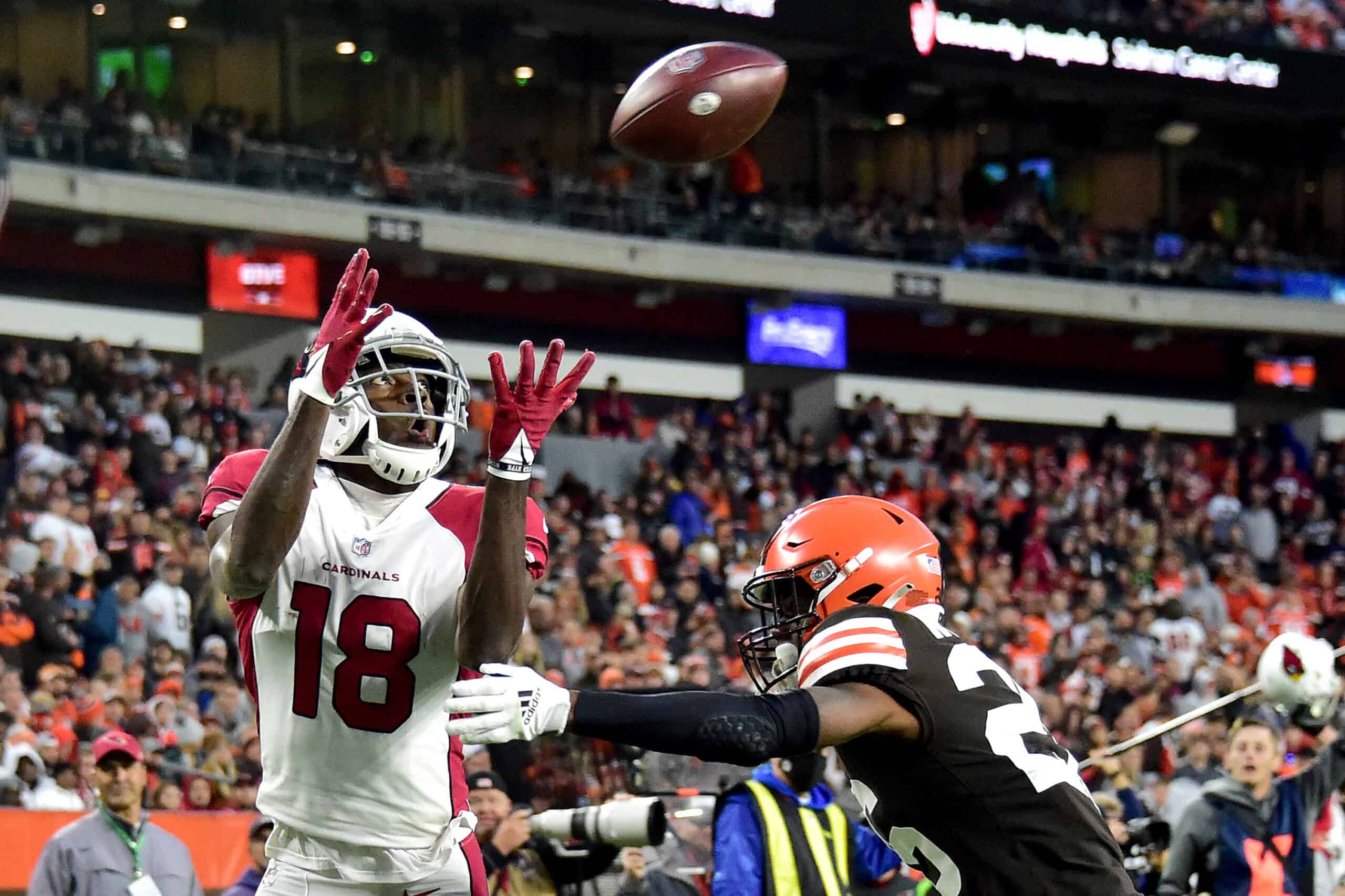  A.J. Green #18 of the Arizona Cardinals catches a touchdown pass under pressure by Greedy Williams #26 of the Cleveland Browns during the fourth quarter at FirstEnergy Stadium on October 17, 2021 in Cleveland, Ohio. 