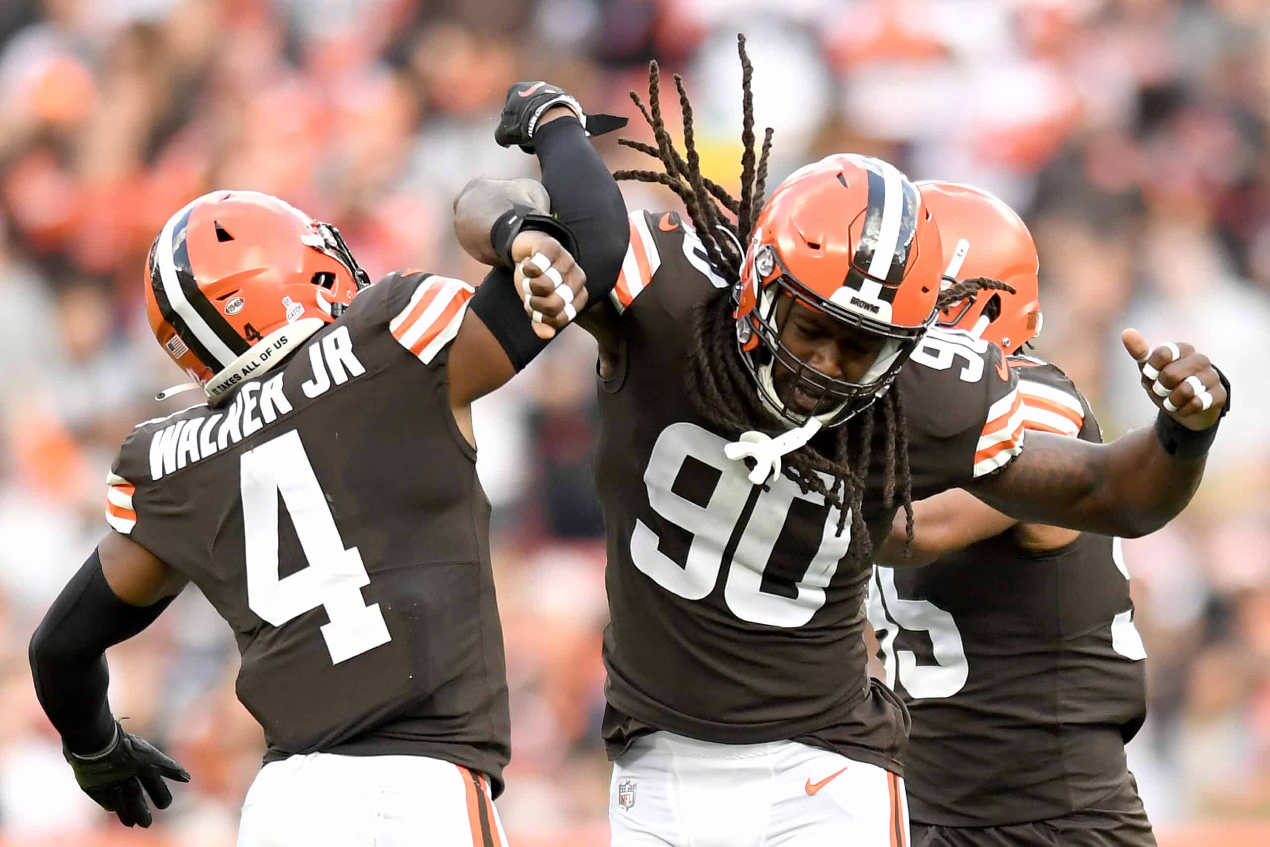 Jadeveon Clowney #90 and Anthony Walker #4 of the Cleveland Browns celebrate a sack by Clowney during the second quarter against the Arizona Cardinals at FirstEnergy Stadium on October 17, 2021 in Cleveland, Ohio. 