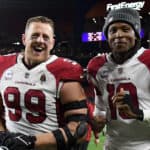 J.J. Watt #99 and DeAndre Hopkins #10 of the Arizona Cardinals react after a 37-14 win against the Cleveland Browns at FirstEnergy Stadium on October 17, 2021 in Cleveland, Ohio.