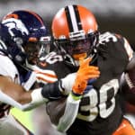 Inside linebacker Justin Strnad #40 of the Denver Broncos tackles running back D'Ernest Johnson #30 of the Cleveland Browns in the first half at FirstEnergy Stadium on October 21, 2021 in Cleveland, Ohio.