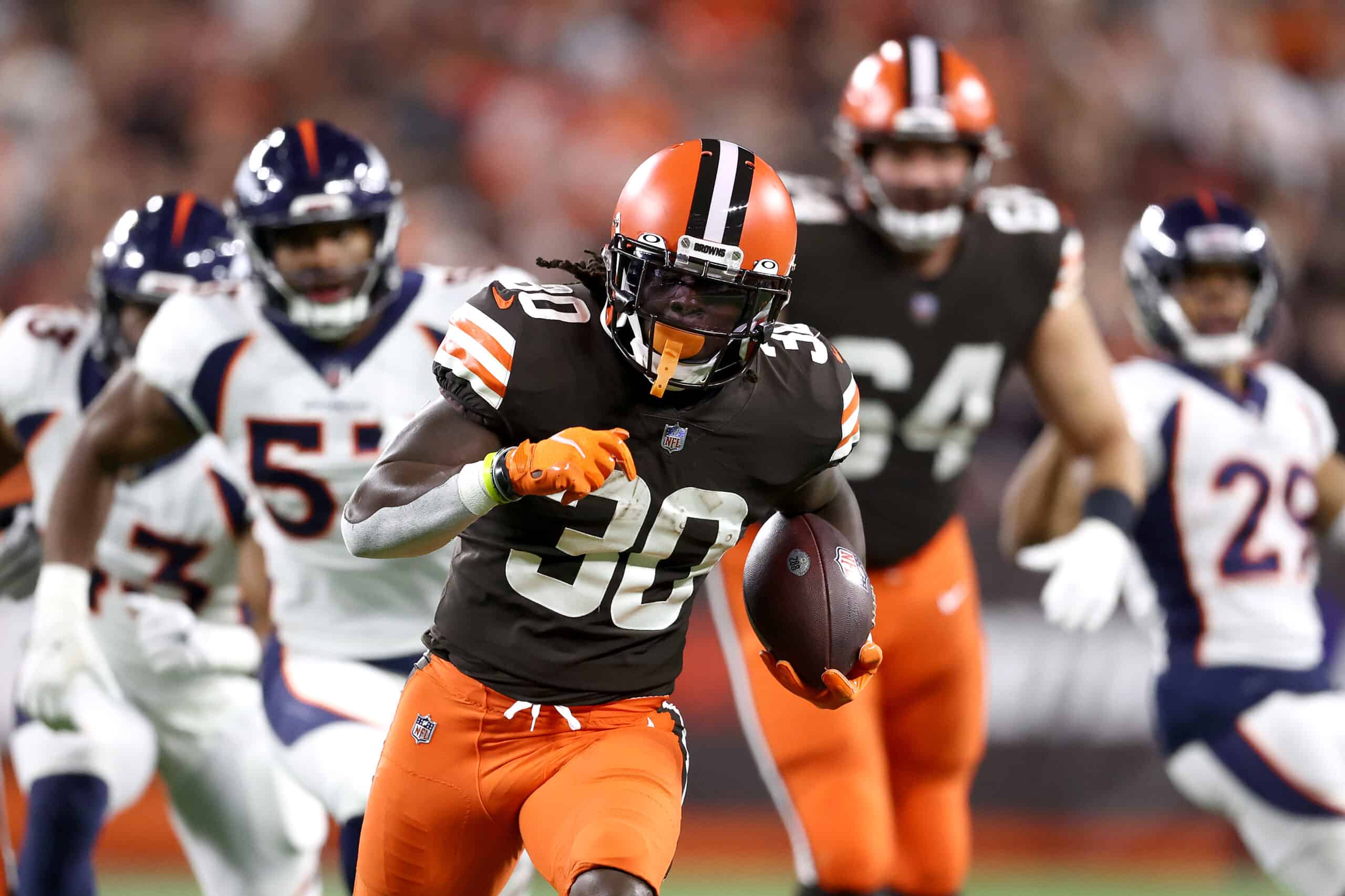 Running back D'Ernest Johnson #30 of the Cleveland Browns runs with the ball after making a first quarter pass against the Denver Broncos at FirstEnergy Stadium on October 21, 2021 in Cleveland, Ohio. 