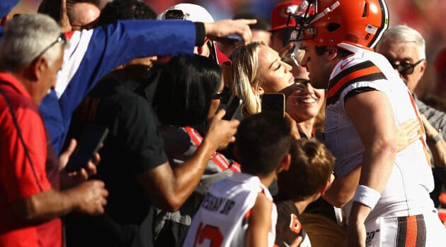 Quarterback Baker Mayfield #6 of the Cleveland Browns kisses Emily Wilkinson before the game against the Francisco 49ers at Levi's Stadium on October 07, 2019 in Santa Clara, California.