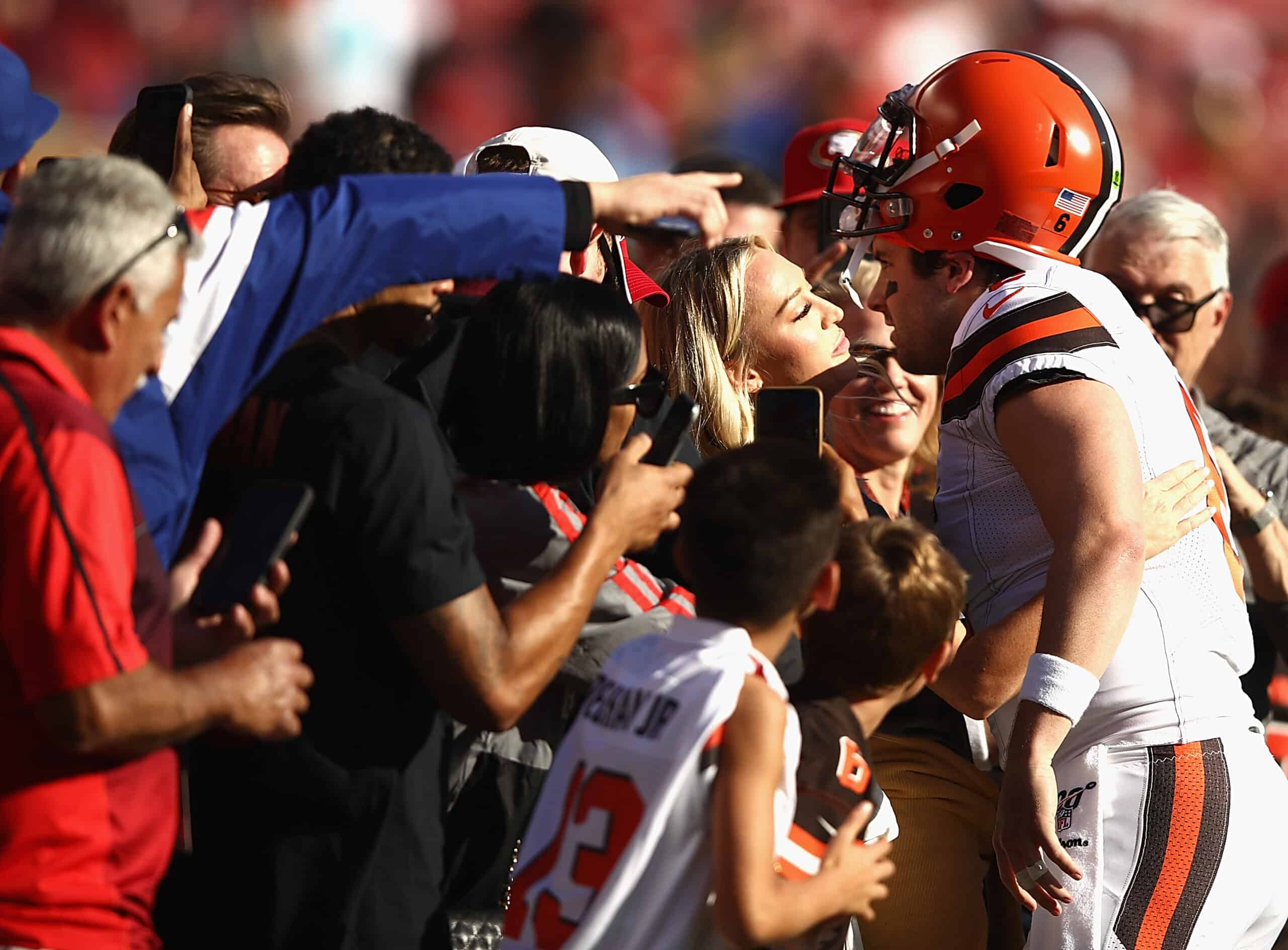 Quarterback Baker Mayfield #6 of the Cleveland Browns kisses Emily Wilkinson before the game against the Francisco 49ers at Levi's Stadium on October 07, 2019 in Santa Clara, California.