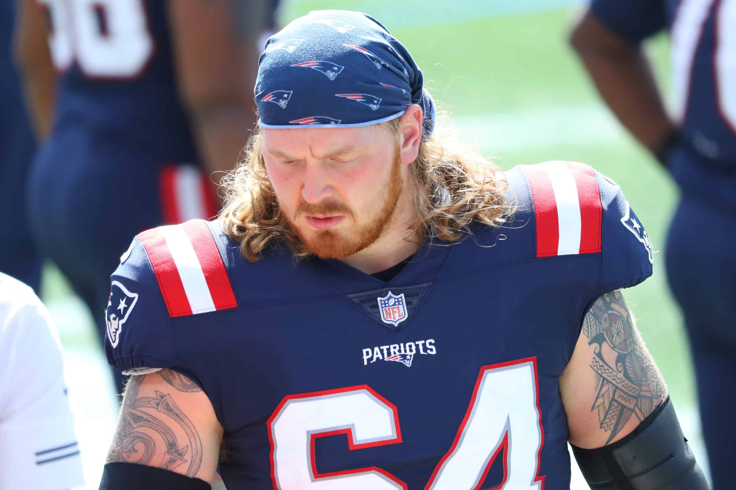 Hjalte Froholdt #64 of the New England Patriots stands on the sideline during the first half against the Miami Dolphins at Gillette Stadium on September 13, 2020 in Foxborough, Massachusetts. 