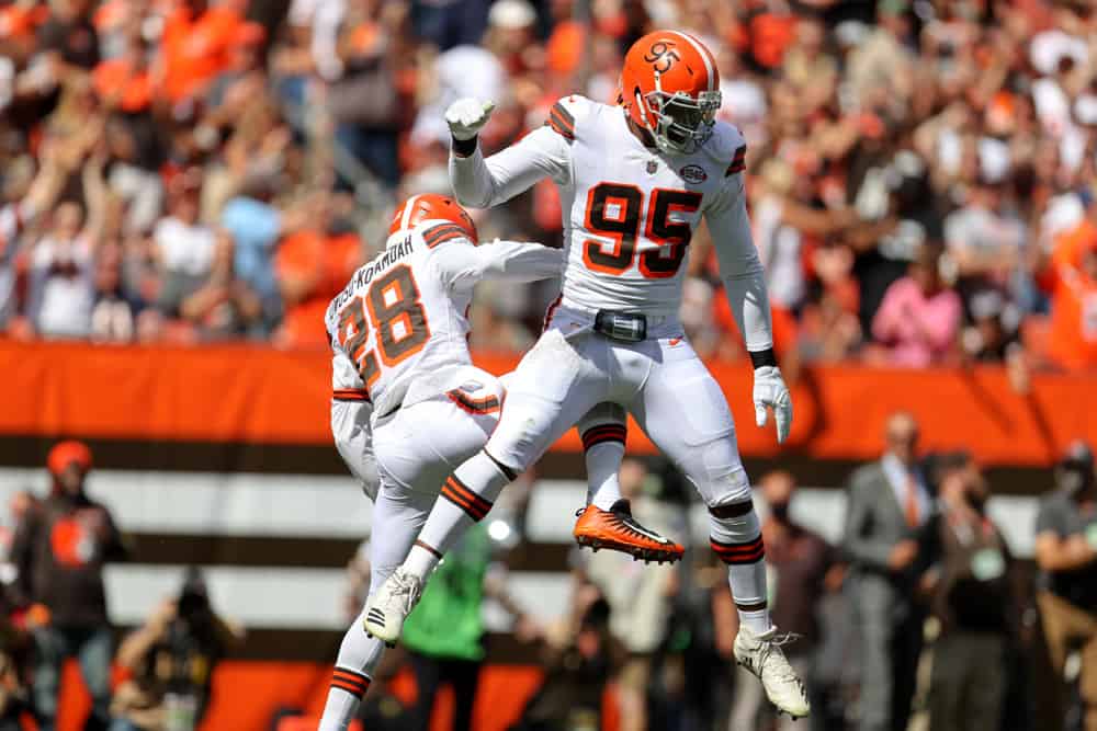 Cleveland Browns defensive end Myles Garrett (95) and Cleveland Browns linebacker Jeremiah Owusu-Koramoah (28) celebrate after sacking Chicago Bears quarterback Justin Fields (1) (not pictured) during the second quarter of the National Football League game between the Chicago Bears and Cleveland Browns on September 26, 2021, at FirstEnergy Stadium in Cleveland, OH.