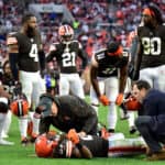Kareem Hunt #27 of the Cleveland Browns is tended to by team medical personnel after an injury during the fourth quarter against the Arizona Cardinals at FirstEnergy Stadium on October 17, 2021 in Cleveland, Ohio.