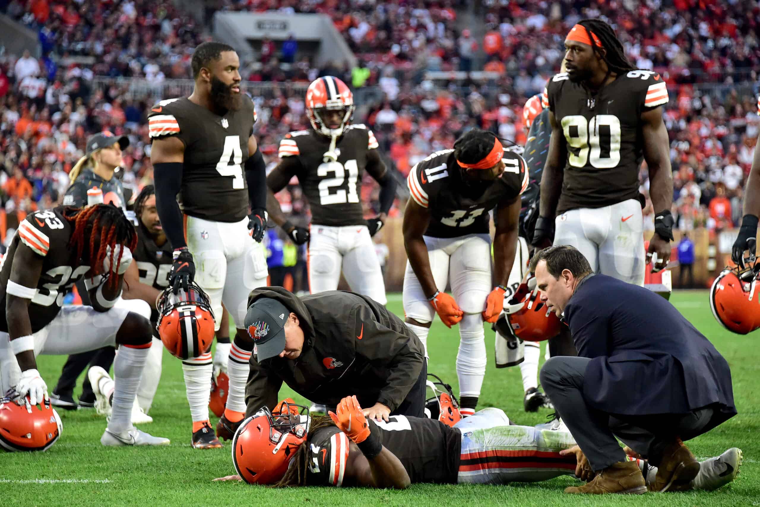 Kareem Hunt #27 of the Cleveland Browns is tended to by team medical personnel after an injury during the fourth quarter against the Arizona Cardinals at FirstEnergy Stadium on October 17, 2021 in Cleveland, Ohio. 