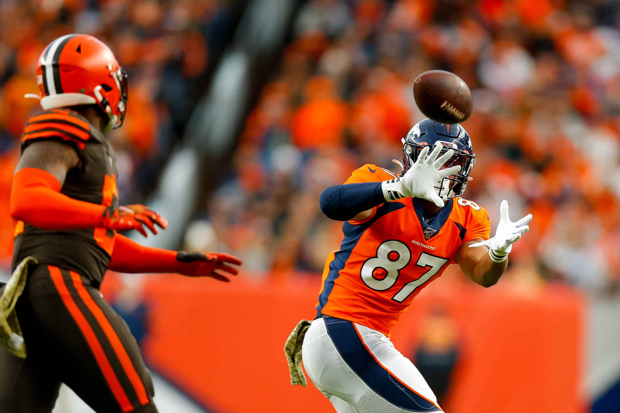 Tight end Noah Fant #87 of the Denver Broncos catches a pass in front of linebacker Mack Wilson #51 of the Cleveland Browns during the third quarter at Empower Field at Mile High on November 3, 2019 in Denver, Colorado. The Broncos defeated the Browns 24-19.