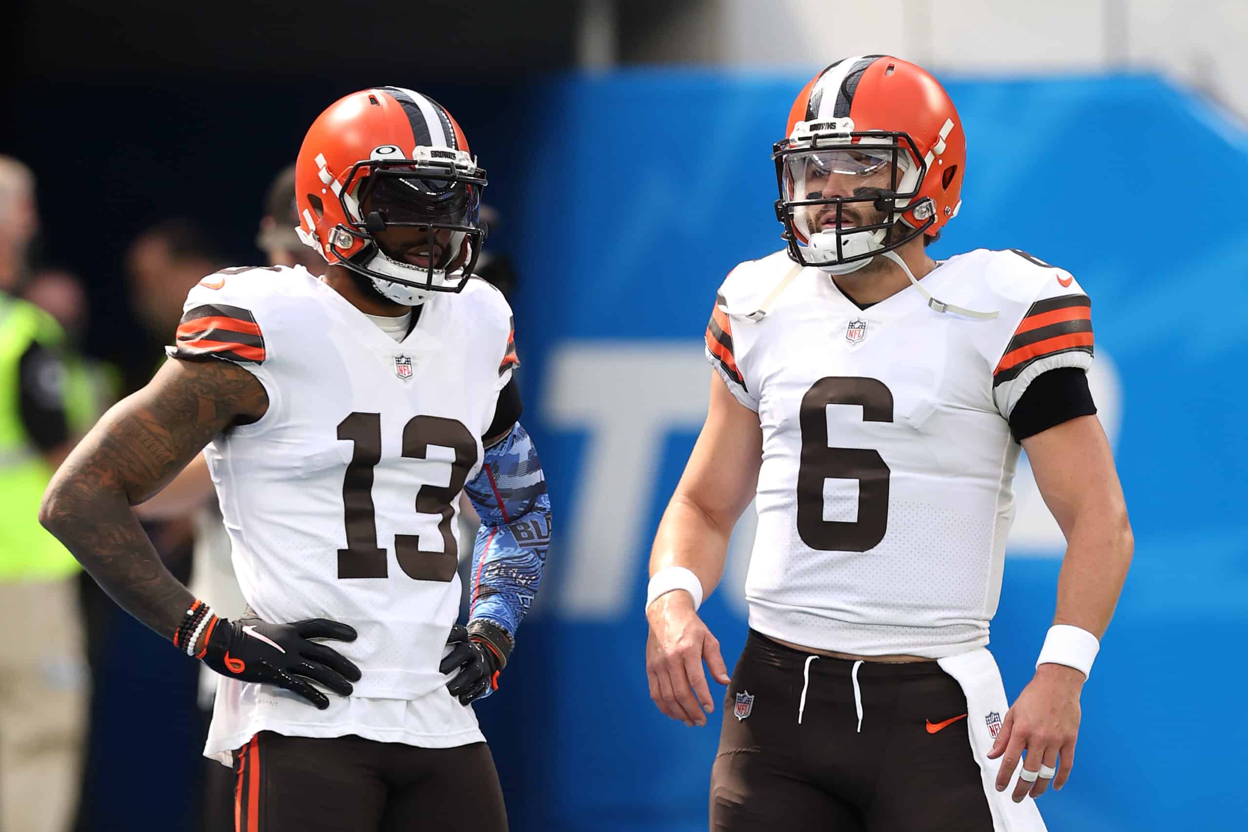 Odell Beckham Jr. #13 and Baker Mayfield #6 of the Cleveland Browns talk on the field before the game against the Los Angeles Chargers at SoFi Stadium on October 10, 2021 in Inglewood, California.