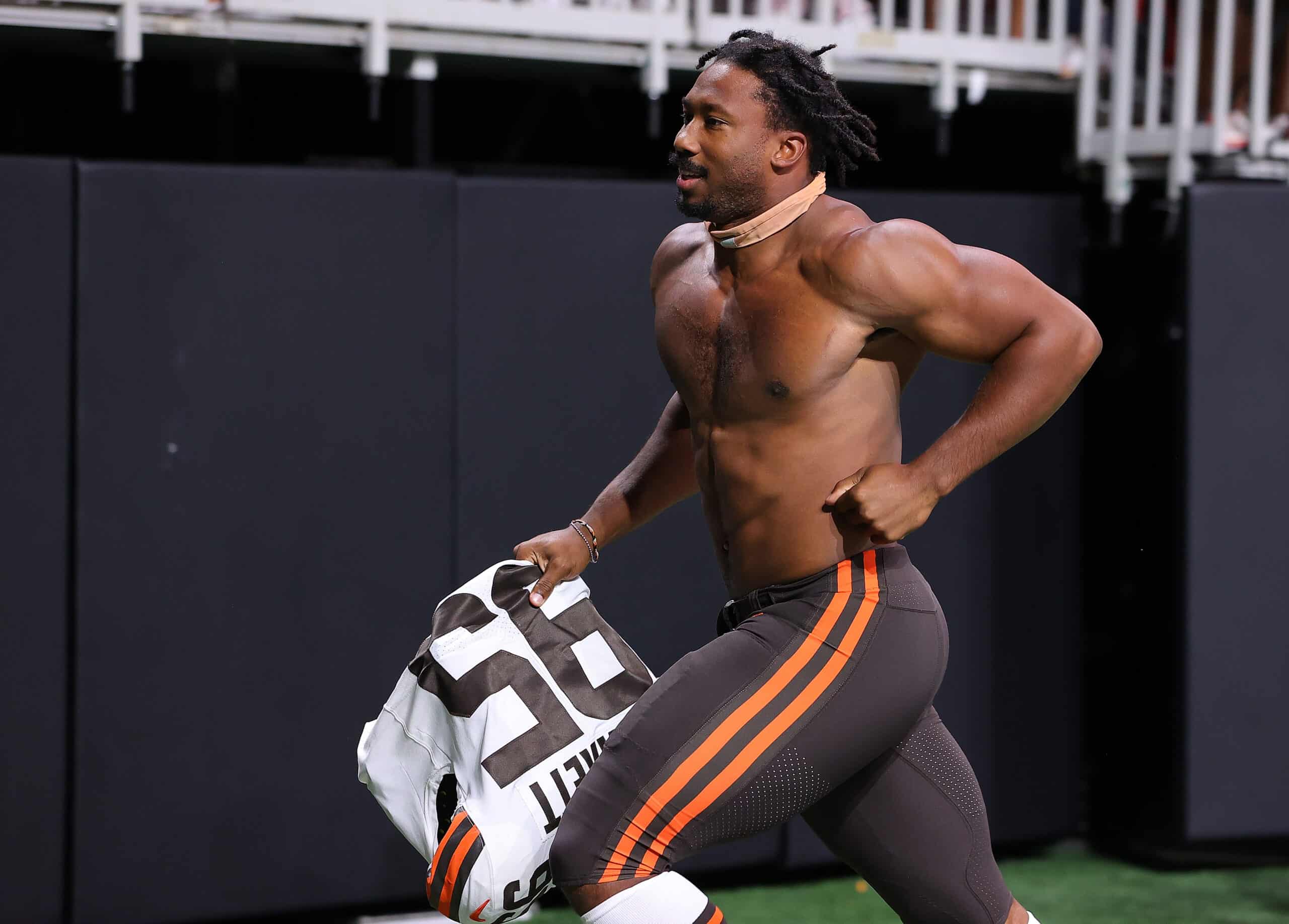 Myles Garrett #95 of the Cleveland Browns runs off the field after their 19-10 win over the Atlanta Falcons at Mercedes-Benz Stadium on August 29, 2021 in Atlanta, Georgia.