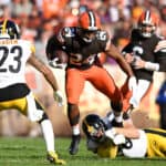 Nick Chubb #24 of the Cleveland Browns avoids the tackle by T.J. Watt #90 of the Pittsburgh Steelers in the second half at FirstEnergy Stadium on October 31, 2021 in Cleveland, Ohio.
