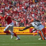Kansas City Chiefs quarterback Patrick Mahomes (15) scrambles in the back field from Cleveland Browns defensive end Takkarist McKinley (55) on September 12th at GEHA field at Arrowhead Stadium in Kansas City, Missouri.